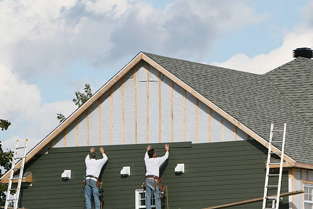 Professional Storm Damage Siding Repair technician working in Dundas, MN